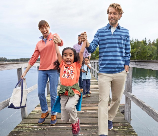 Family walking down a dock.