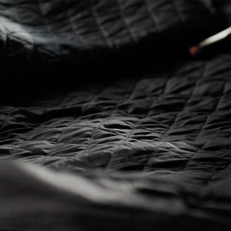 A close up view of the black, plush primaloft insulation