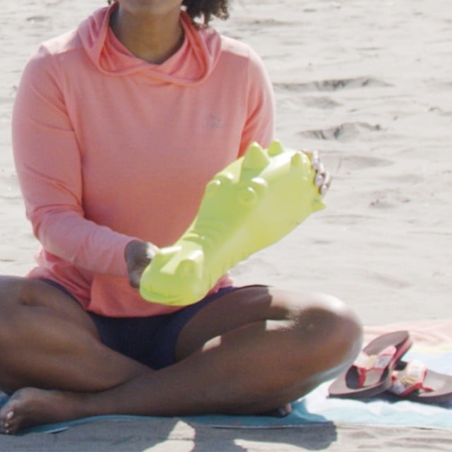 Close-up of Stephanie holding a sand sculpture mold.