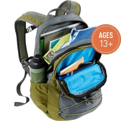 A Comfort Carry Laptop Pack, 30L, open to show contents, a circle with text Ages 13 plus.