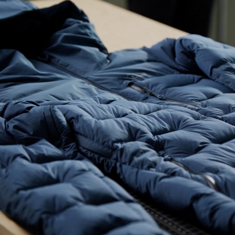 A close up detail shot of the windchallenger jacket styled in a way that accentuates the plush 650 Fill Downtek down