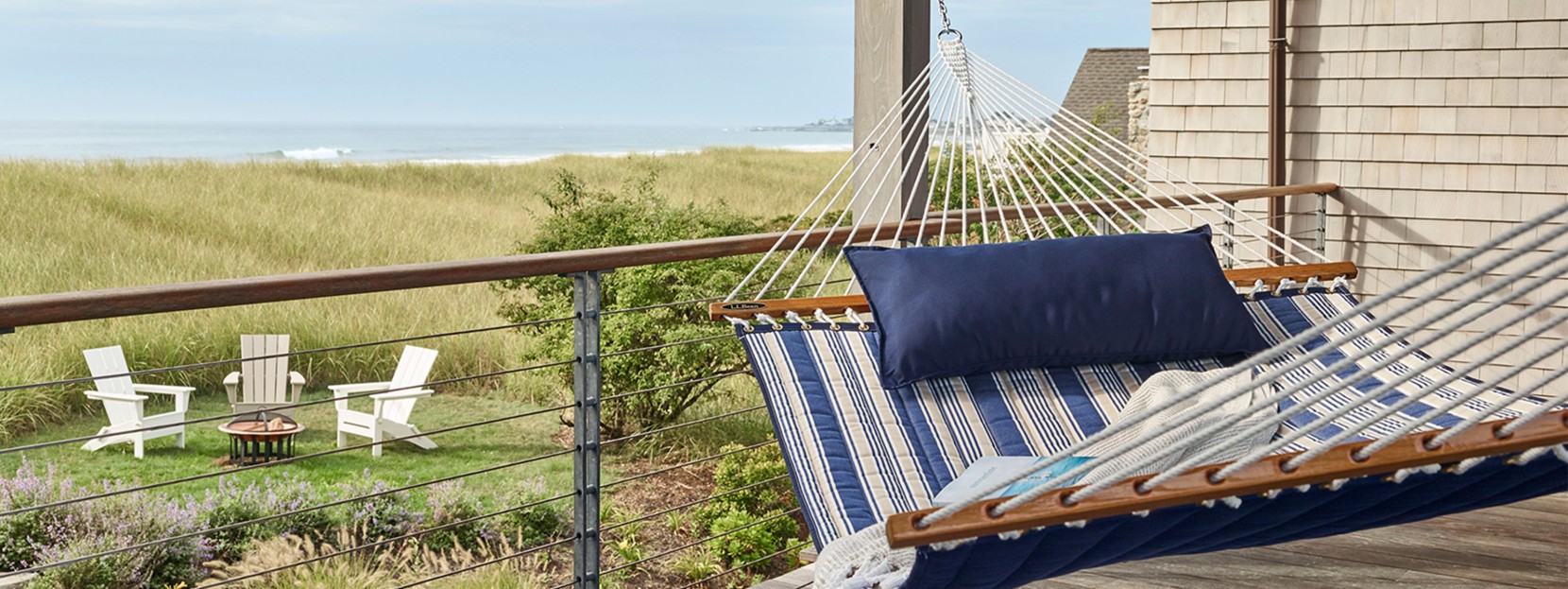 Hammock on porch overlooking beach.