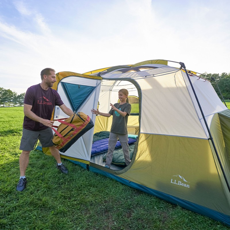 Father and daughter in tent.